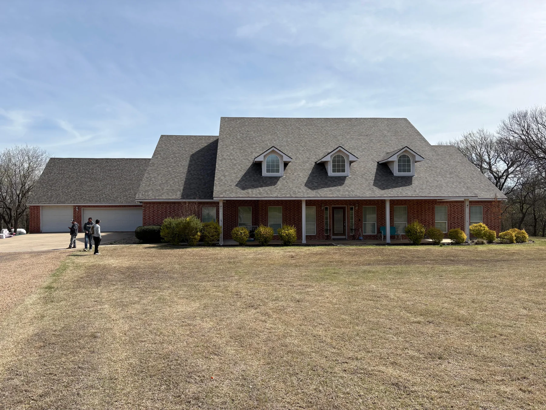 Completed Owens Corning Driftwood shingle roof in Denison Texas