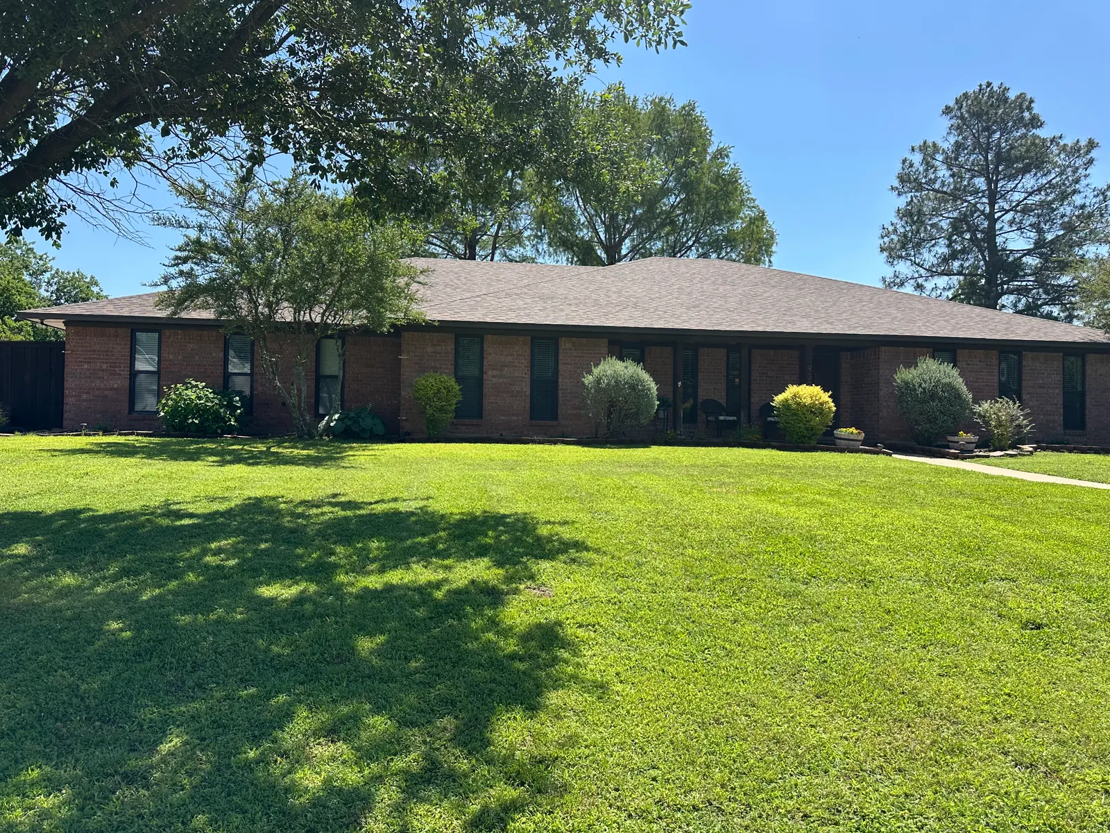 Completed Teak shingle roof on a brick home in Denison, TX, May 2025.