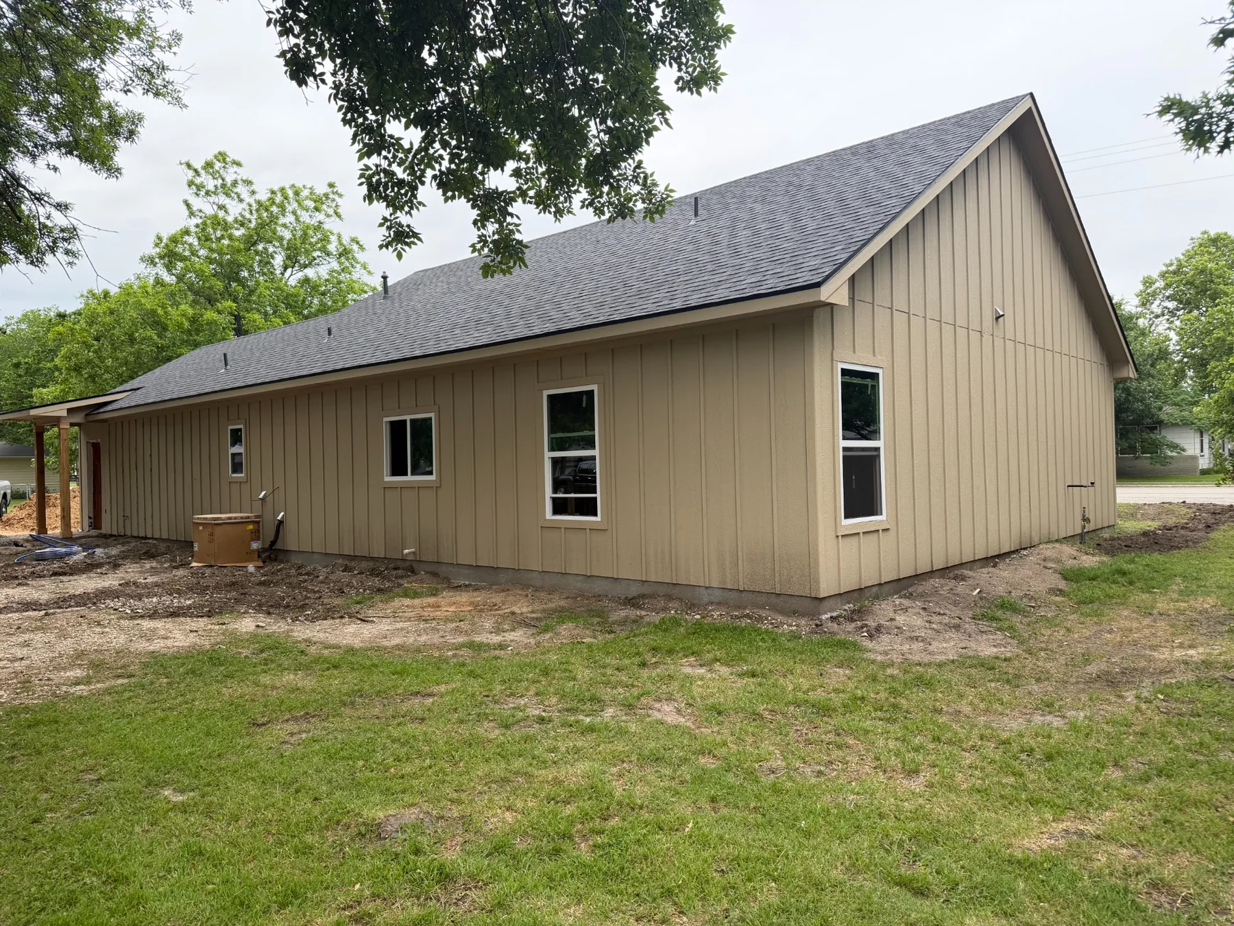 Completed new-construction shingle roof viewed from the side in Lindsay Texas