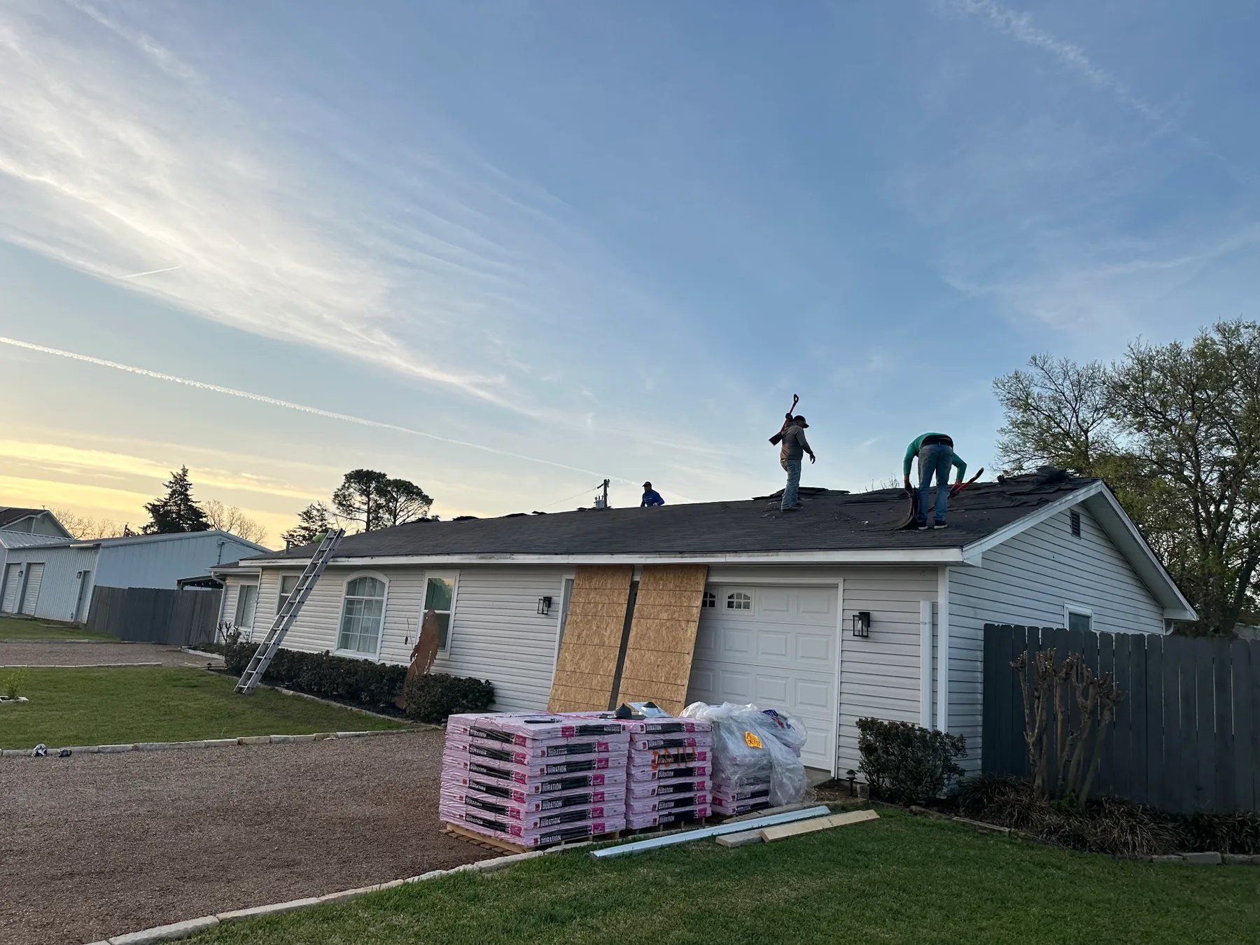 Roof tear-off in progress on a hail-damaged home in Pottsboro Texas