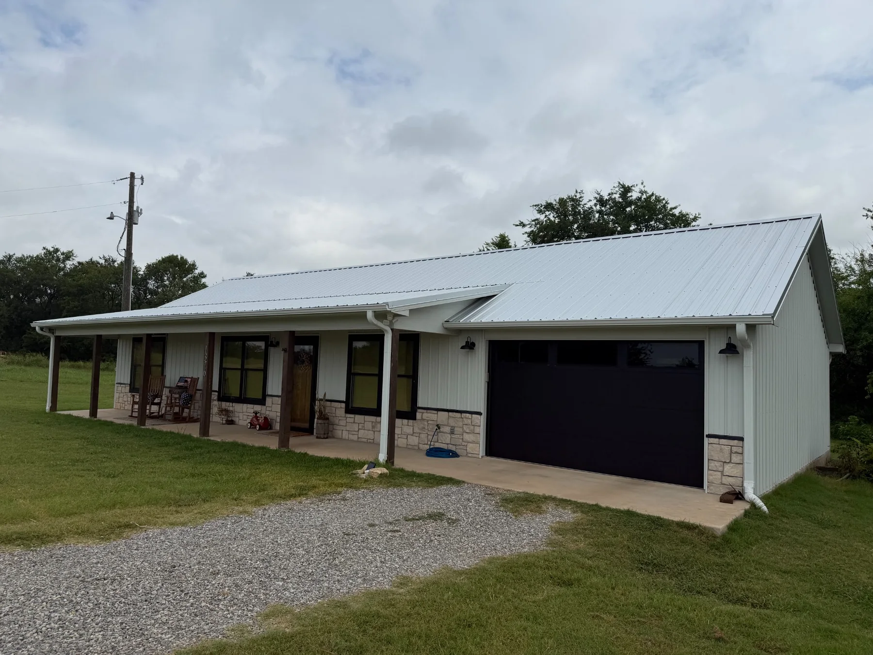 Completed Galvalume metal roof viewed from the front in Tom Bean Texas