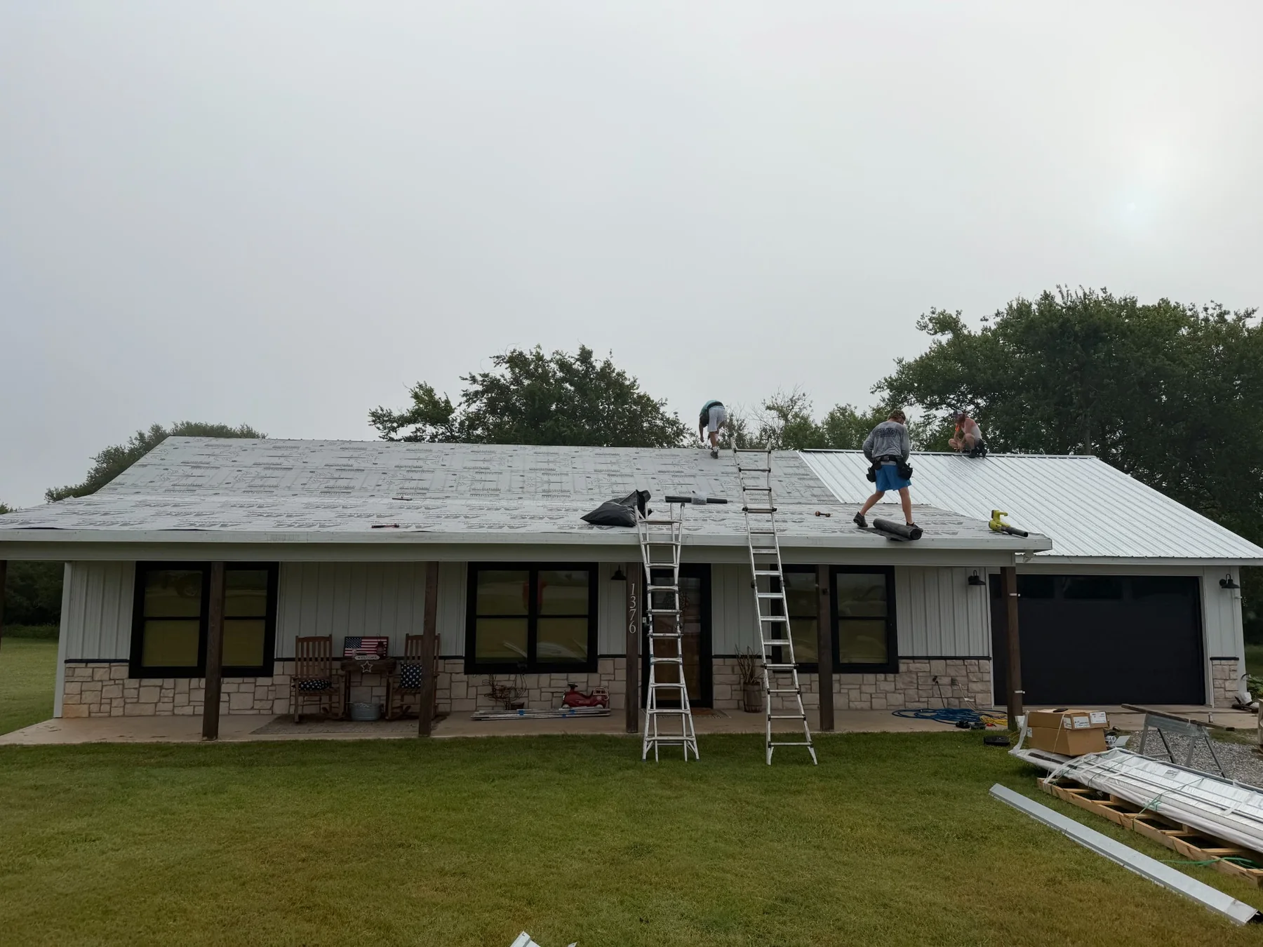 Metal roof replacement in progress on a Tom Bean Texas home